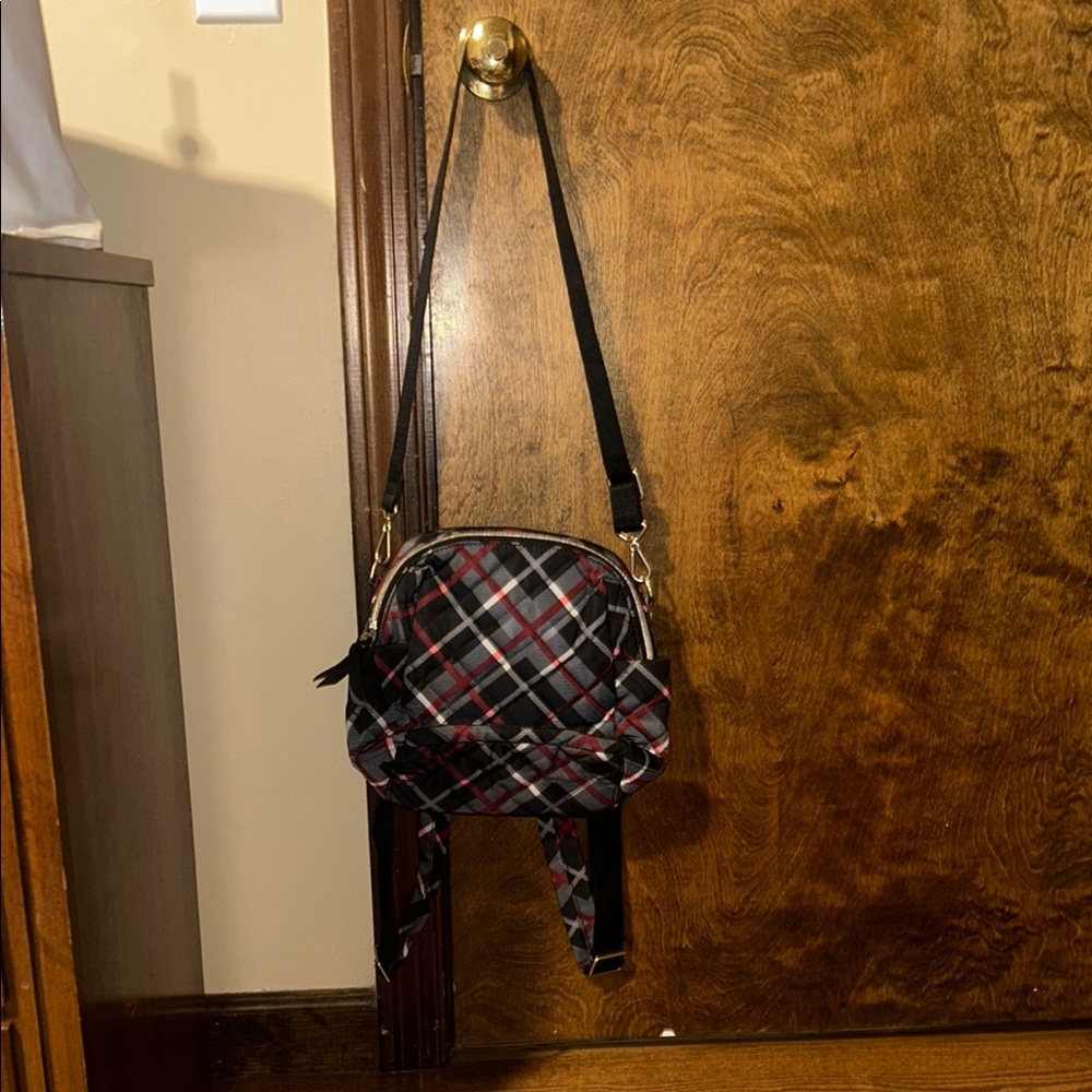 Black and Red Backpack with Adjustable Strap and Plaid Pattern